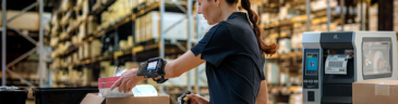 a woman holding a barcode scanner