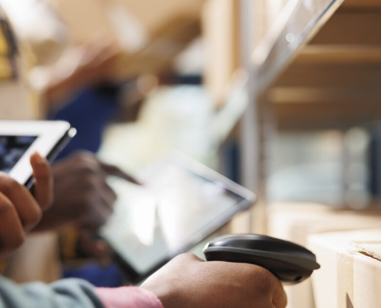 a person using a scanner to scan a product